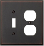 Amerelle Manhattan Single Toggle/Single Duplex Cast Metal Wallplate in Aged Bronze